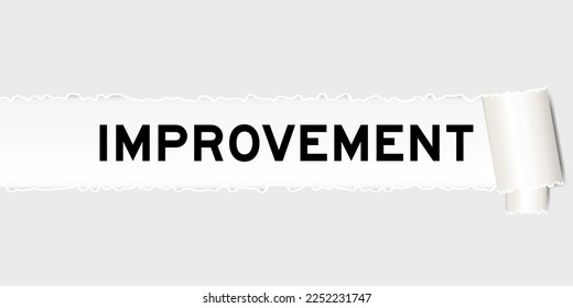 Ripped gray paper background that have word improvement under torn part