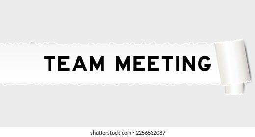 Ripped gray paper background that have word team meeting under torn part