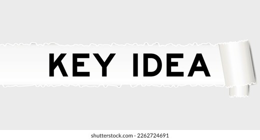 Ripped gray paper background that have word key idea under torn part