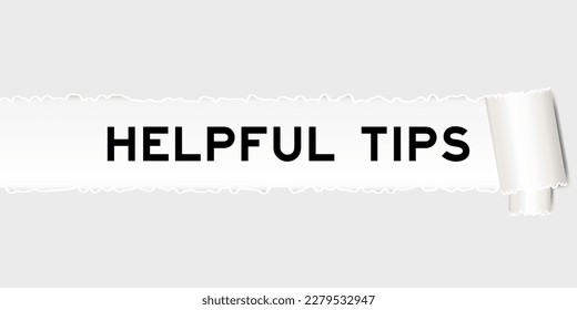 Ripped gray paper background that have word helpful tips under torn part