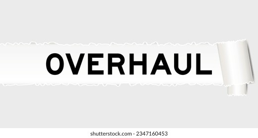 Ripped gray paper background that have word overhaul under torn part