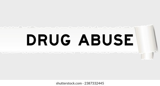 Ripped gray paper background that have word drug abuse under torn part