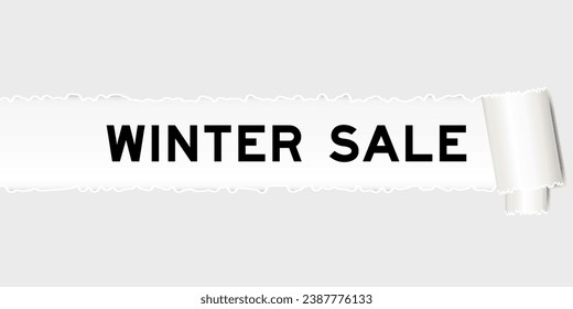 Ripped gray paper background that have word winter sale under torn part