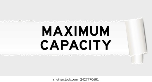 Ripped gray paper background that have word maximum capacity under torn part