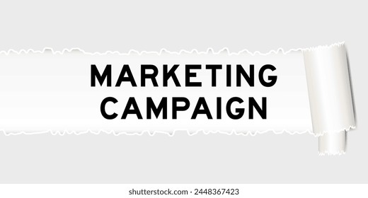 Ripped gray paper background that have word marketing campaign under torn part