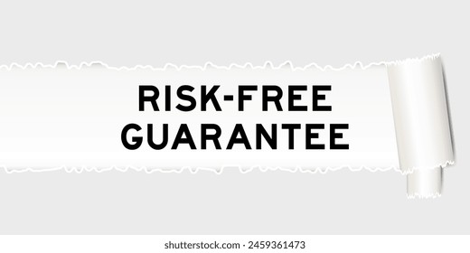 Ripped gray paper background that have word risk free guarantee under torn part
