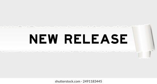 Ripped gray paper background that have word new release under torn part