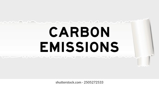 Ripped gray paper background that have word carbon emissions under torn part