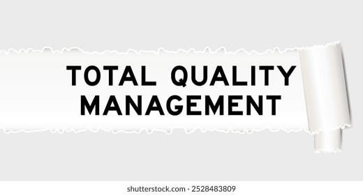 Ripped gray paper background that have word total quality management under torn part