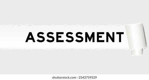 Ripped gray paper background that have word assessment under torn part