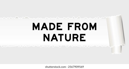 Ripped gray paper background that have word made from nature under torn part