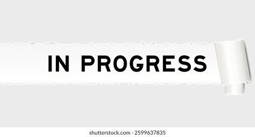 Ripped gray paper background that have word in progress under torn part