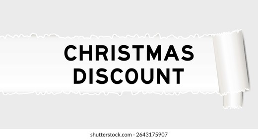 Ripped gray paper background that have word christmas discount under torn part