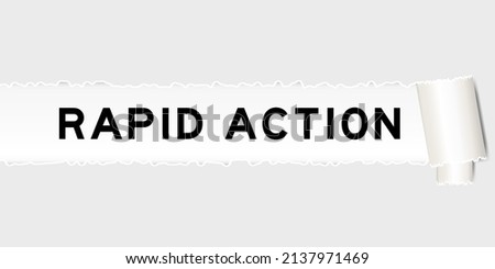 Ripped gray paper background that have word rapid action under torn part