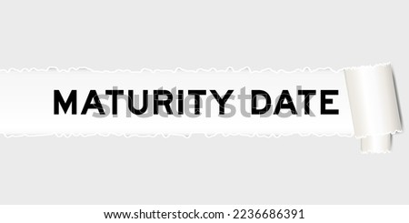 Ripped gray paper background that have word maturity date under torn part