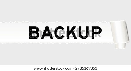 Ripped gray paper background that have word backup under torn part