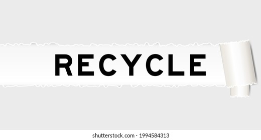 Ripped gray paper that have word recycle under torned part