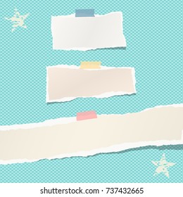 Ripped paper strips, notebook, note for text or message stuck with colorful sticky tape on blue squared background with stars.