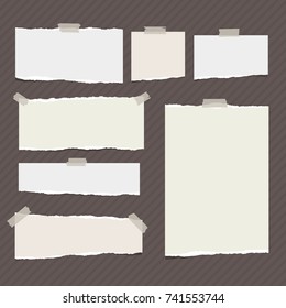 Ripped paper strips, notebook sheet for note or message stuck with sticky tape on brown striped background.