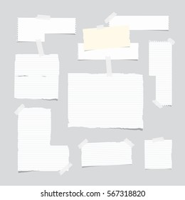 Ripped ruled note, notebook, copybook paper sheet, strips stuck with white sticky tape on light gray background