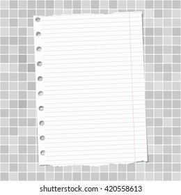 Ripped white lined notebook paper is stuck on light gray wall