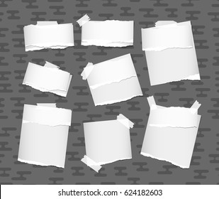 Ripped white note, notebook, copybook paper strips stuck with sticky tape on gray rounded lines pattern
