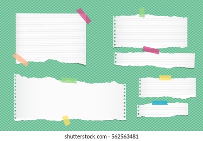 Ripped white ruled note, notebook, copybook paper sheets, strips stuck with colorful sticky tape on green squared pattern