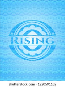 Rising sky blue water wave emblem.
