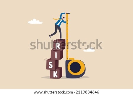 Risk assessment, analyze potential danger level, measure money loss acceptable for investing, control or limit loss concept, businessman investor stand on stack of risk boxes measure his assessment.