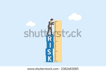 Risk assessment and management. Analayzing risk and consequence. Minimizing danger and failure. Businessman measures risk with a ruler