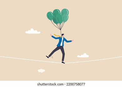 Risk management control or assessment on uncertainty, plan to survive in crisis or danger situation, reduce loss or disaster concept, businessman acrobat walk on the rope with balloons to reduce risk.