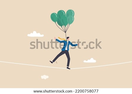 Risk management control or assessment on uncertainty, plan to survive in crisis or danger situation, reduce loss or disaster concept, businessman acrobat walk on the rope with balloons to reduce risk.