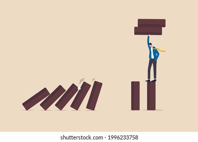 Risk Management, Protect Business From Disaster Or Crisis, Leadership To Avoid Losing Money, Problem And Failure Concept, Smart Businessman Company Leader Remove Domino To Stop Domino Effect Collapse.