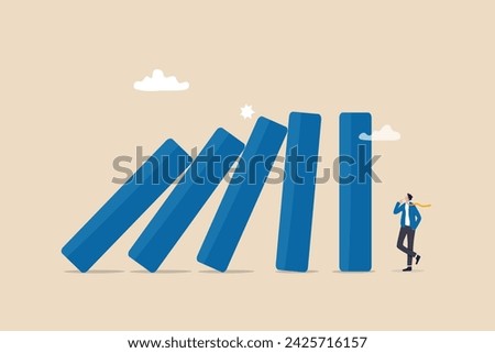 Risk management, uncertainty or unknown threat causing business failure, economic crisis, danger or problem, security and safety concept, courage businessman thinking look at collapsing domino effect.