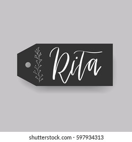 Rita - common female first name on a tag, perfect for seating card usage. One of wide collection in modern calligraphy style.