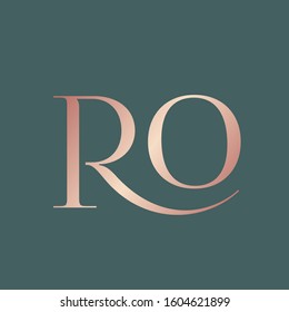 RO monogram logo.Elegant style typographic icon.Lettering sign.Alphabet initials in rose gold metal color isolated on dark background.Uppercase luxury letter r and letter o.Beauty modern characters.