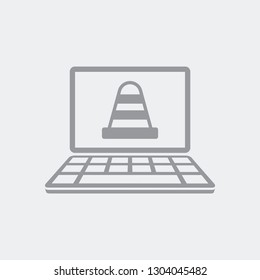 Road cone on computer laptop