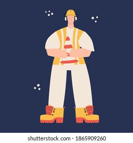 Road Construction or factory worker wearing hard hat, earmuffs, high visibility vest, work clothing and boots. Worker with traffic safety cone. Health and safety at work. PPE