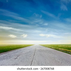 road in a fields at sunset, vector