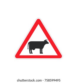 a road sign with a cow