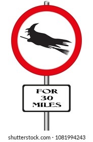 A road sign warning of witches ahead and isolated on a white background