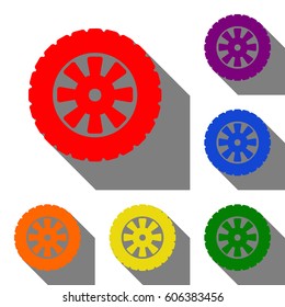 Road tire sign. Set of red, orange, yellow, green, blue and violet icons at white background with flat shadow.