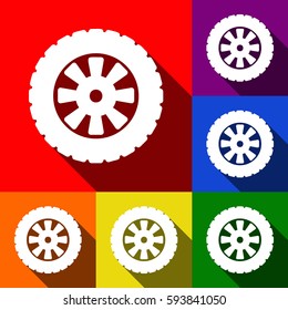 Road tire sign. Vector. Set of icons with flat shadows at red, orange, yellow, green, blue and violet background.