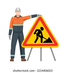 A Road Worker Stands At A 