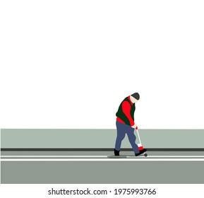 Road worker with thermoplastic spray marking machine working to paint white lines on asphalt road surface.