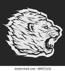 Roaring lion head. Dark background.