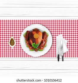 Roasted turkey bird on white plate with fork and knife on white wooden table