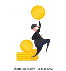 The robber holds a gold coin in his hands. The thief stole the money. Robbery and security concept. Isolated. Vetkor.