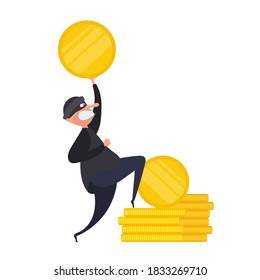 The robber holds a gold coin in his hands. The thief stole the money. Robbery and security concept. Isolated. Vetkor.