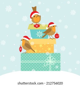  Robins with Christmas decoration on gift boxes.